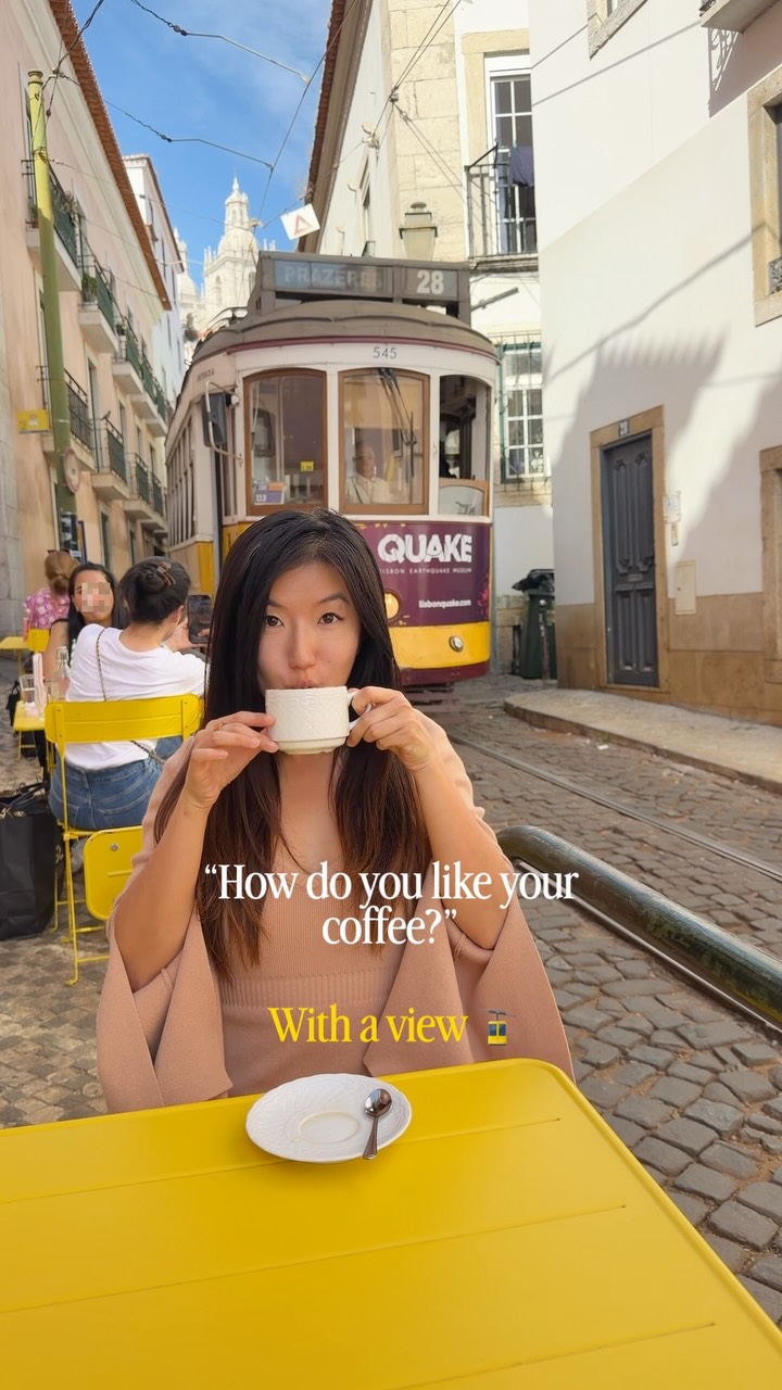 With a tram passing by right next to me in Lisbon, Portugal 😄☕️ this spot is so cool and great for relaxing and watching all the trams🚡 let me know if you want the link to the exact location :)