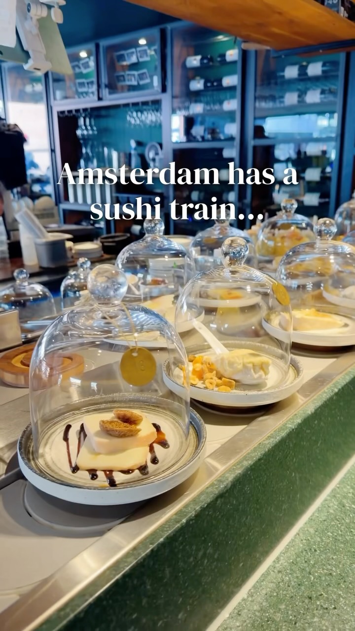 Amsterdam’s sushi train, except every plate is cheese 🧀

Kaasbar has 30+ cheeses circling on a conveyor belt, and you just grab whatever catches your eye. Every dome has a number that matches the menu, so you know exactly what you’re trying. Think water buffalo cheese with white chocolate and gold, cow’s milk cheese with kimchi, plus charcuterie to pair and dessert cheese to finish.

📍 Kaasbar, Amsterdam
Save this for your Amsterdam trip ✨
Follow @traveljeanieous for more gems around the world 🌍

#amsterdam #amsterdamfood #cheeselover #netherlandstravel #uniquerestaurants