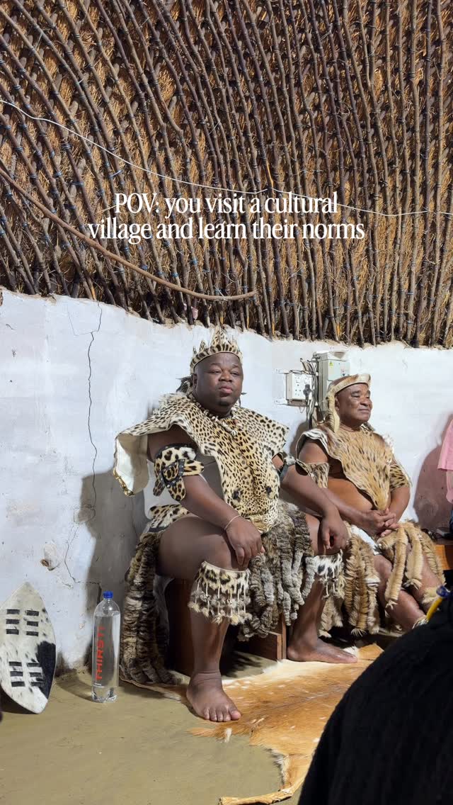 😂 women are only allowed to sit with their legs straight out in front of them, but not cross legged because it exposes their private areas. They also sit on the floor, while the men sit on the chairs lol such an entertaining experience visiting this cultural village in South Africa!